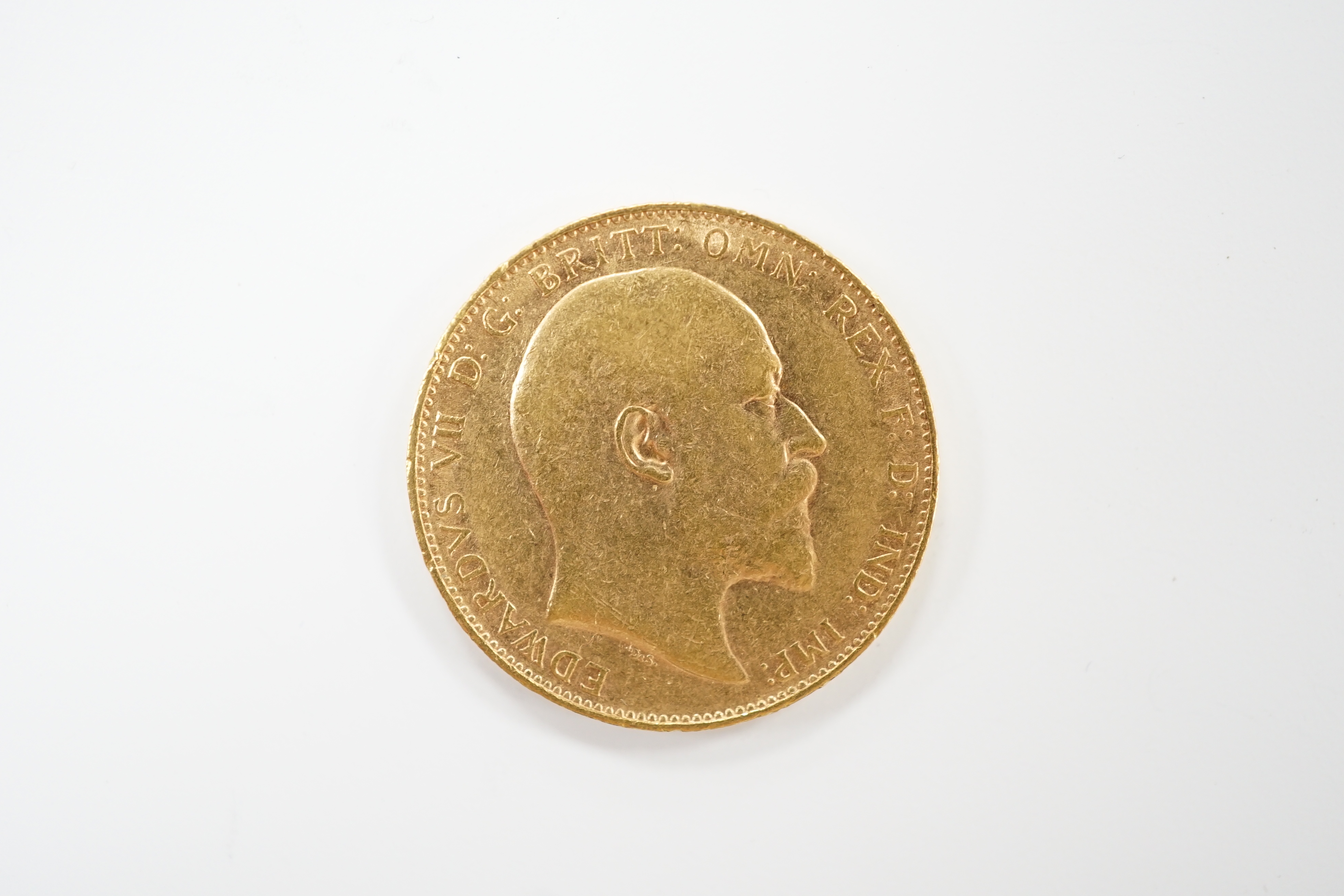 An Edward VII 1909 gold sovereign.